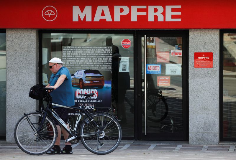 &copy; Reuters. FILE PHOTO: A man walks past an office of Spain's insurance company Mapfre, in Ronda, Spain, April 23, 2024. REUTERS/Jon Nazca/File Photo