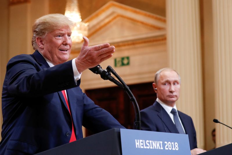 © Reuters. FILE PHOTO: U.S. President Donald Trump gestures during a joint news conference with Russia's President Vladimir Putin after their meeting in Helsinki, Finland, July 16, 2018. REUTERS/Kevin Lamarque/File Photo