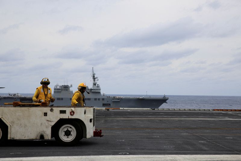 &copy; Reuters. United States Seventh Fleet conducts joint exercises aboard USS Carl Vinson flanked by Japan's helicopter carrier Hyuga, in the Pacific Ocean November 11, 2023. REUTERS/Sakura Murakami/File Photo