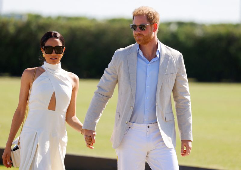 &copy; Reuters. Príncipe britânico Harry ao lado de sua esposa Meghan em Wellington, no Estado norte-americano da Flóridan12/04/2024 REUTERS/Marco Bello