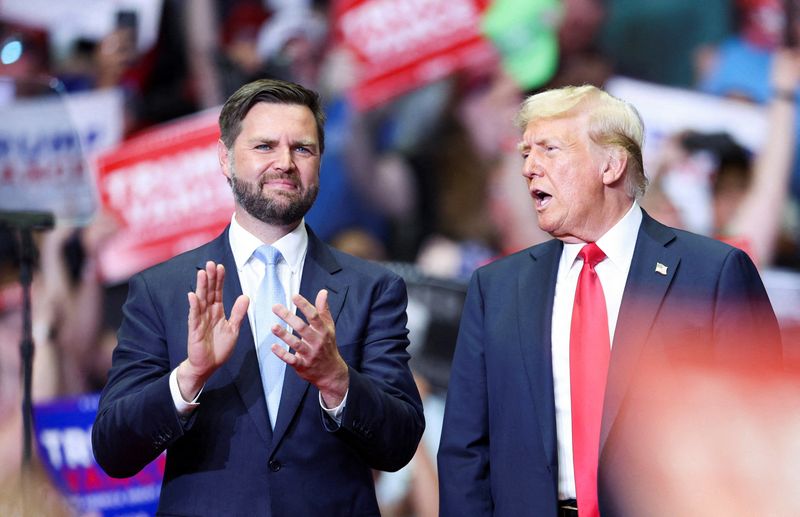 &copy; Reuters. FILE PHOTO: Republican presidential nominee and former U.S. President Donald Trump stands with Republican vice presidential nominee U.S. Senator J.D. Vance (R-OH), as he holds a rally for the first time with his running mate, in Grand Rapids, Michigan, U.