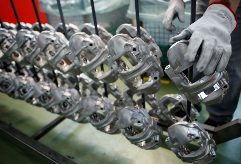 &copy; Reuters. A technician works on brake disc components in the Brembo factory in Curno, Italy June 19, 2017. Picture taken June 19, 2017.    REUTERS/Alessandro Garofalo/ File Photo