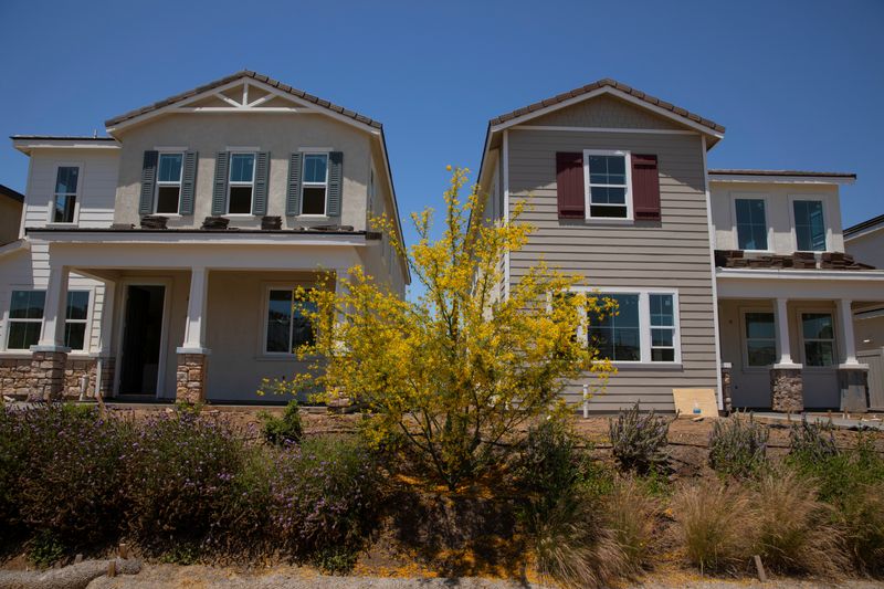 © Reuters. Residential single family homes construction by KB Home are shown under construction in the community of Valley Center, California, U.S. June 3, 2021.   REUTERS/Mike Blake/ File Photo