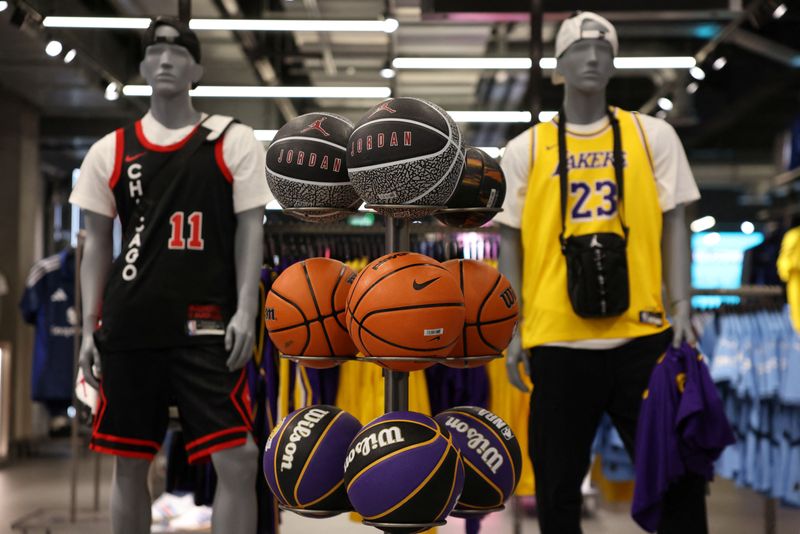 © Reuters. Nike basketballs are displayed at the newly renovated JD Sports store at Westfield Stratford City in London, Britain, July 30, 2024. REUTERS/Hollie Adams