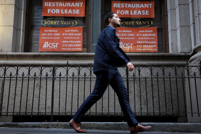 &copy; Reuters. FILE PHOTO: A man walks past "for lease" signs on the former location of Bobby Van's Steakhouse in the financial district of New York City, U.S., October 7, 2022. REUTERS/Brendan McDermid/File Photo