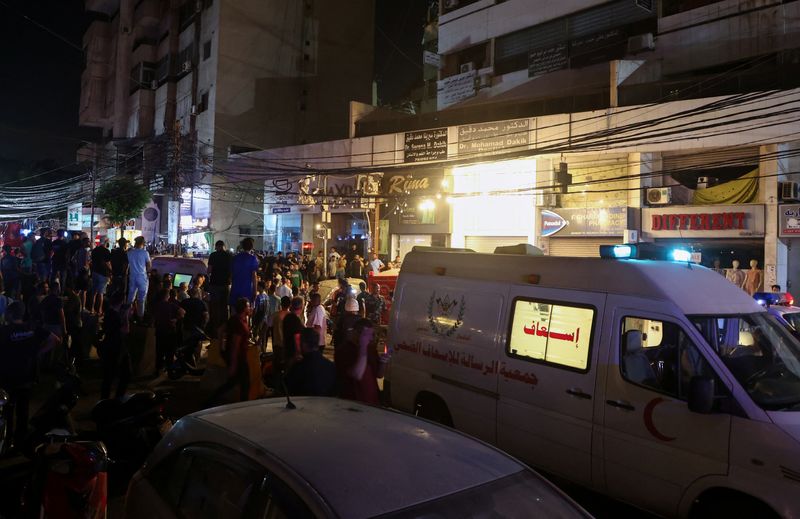 © Reuters. An ambulance is parked near a site hit by what security sources said was a strike on Beirut's southern suburbs, Lebanon July 30, 2024. REUTERS/Mohamed Azakir