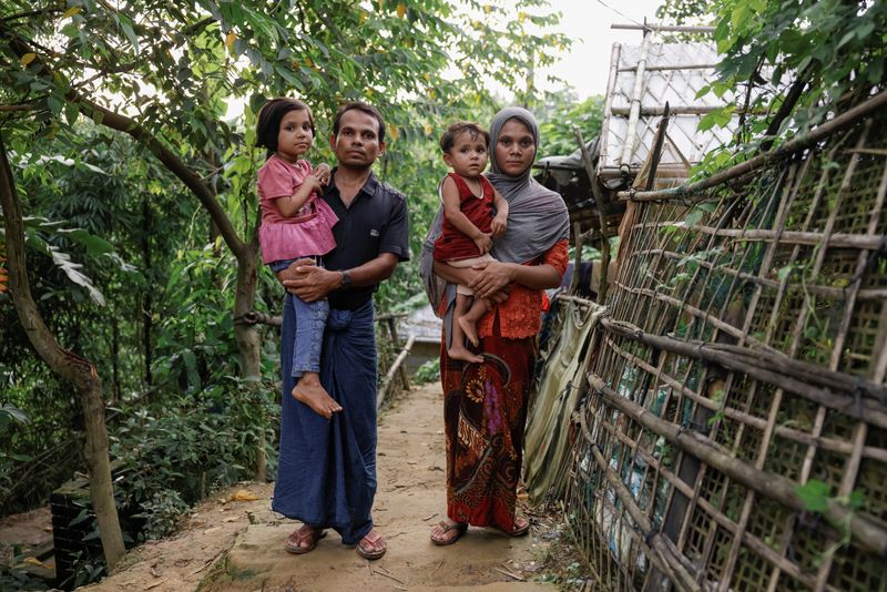 © Reuters. Saifur Rahman and his family, who said they fled from Buthidaung, Myanmar, to Bangladesh, pose for a picture at a refugee camp in Cox's Bazar, Bangladesh, June 25, 2024. REUTERS/Mohammad Ponir Hossain