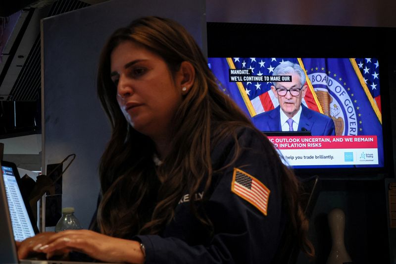 &copy; Reuters. FILE PHOTO: A trader works, as a screen broadcasts a news conference by U.S. Federal Reserve Chair Jerome Powell following the Fed rate announcement, on the floor of the New York Stock Exchange (NYSE) in New York City, U.S., June 12, 2024.  REUTERS/Brenda