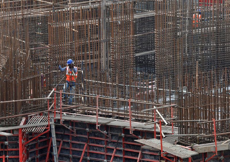 &copy; Reuters. A man works on a construction site of a residential building in Mumbai, India, October 31, 2016. REUTERS/Shailesh Andrade/ File Photo