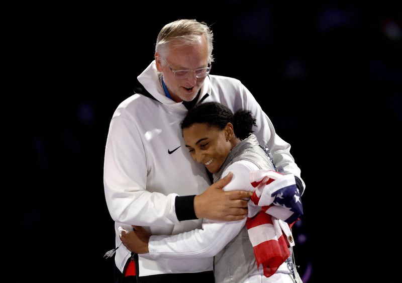 &copy; Reuters. FILE PHOTO: Paris 2024 Olympics - Fencing - Women's Foil Individual Gold Medal Bout - Grand Palais, Paris, France - July 28, 2024. Lauren Scruggs of United States reacts after losing her gold medal bout against Lee Kiefer of United States. REUTERS/Albert 