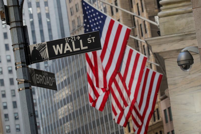 &copy; Reuters. A Wall St. sign is seen outside the New York Stock Exchange (NYSE) in the financial district in New York City, U.S., March 2, 2020. REUTERS/Brendan McDermid/File Photo