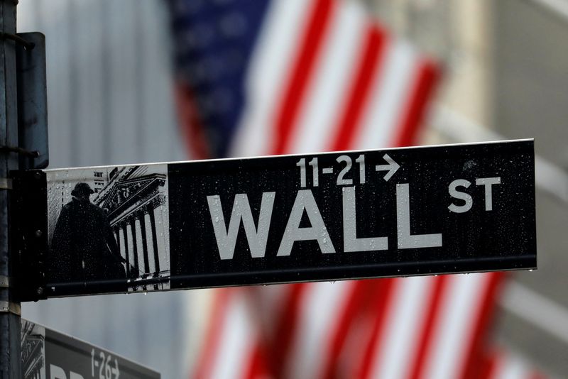 &copy; Reuters. FILE PHOTO: A sign for Wall Street outside the New York Stock Exchange in Manhattan in New York City, New York, U.S., October 26, 2020. REUTERS/Mike Segar/File Photo