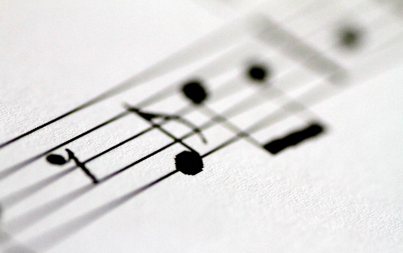 &copy; Reuters. FILE PHOTO: Musical notes are seen on on sheet music in this illustration photo April 4, 2018.    REUTERS/Thomas White/Illustration/File Photo