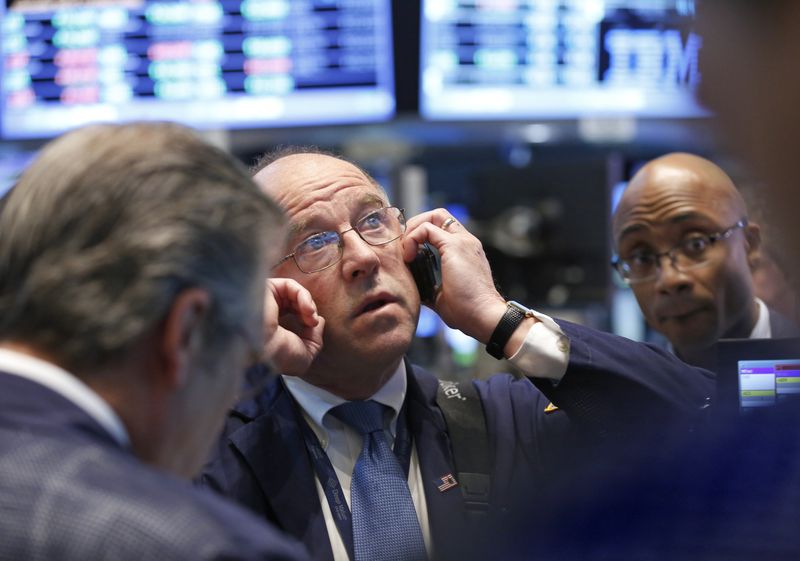 &copy; Reuters. FILE PHOTO: Traders work on the floor at the New York Stock Exchange, April 25, 2013. REUTERS/Brendan McDermid/File Photo