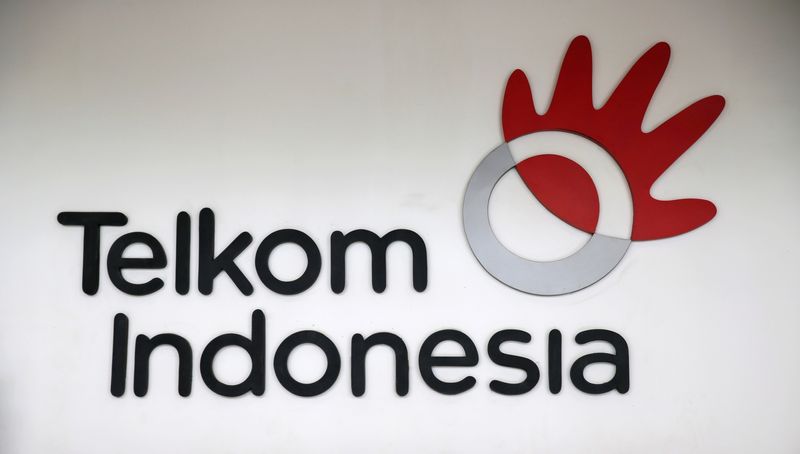 &copy; Reuters. FILE PHOTO: The logo of Indonesia's largest telecommunications services company PT Telekomunikasi Indonesia (Telkom) is seen at Plasa Telkom building in Jakarta, April 30, 2018. REUTERS/Beawiharta/File Photo