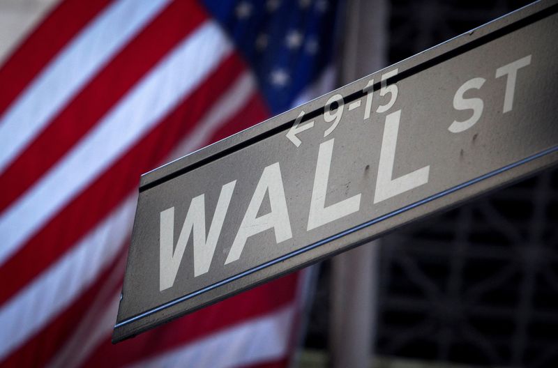 &copy; Reuters. FILE PHOTO: A Wall Street sign is pictured outside the New York Stock Exchange in New York, October 28, 2013.  REUTERS/Carlo Allegri/File Photo