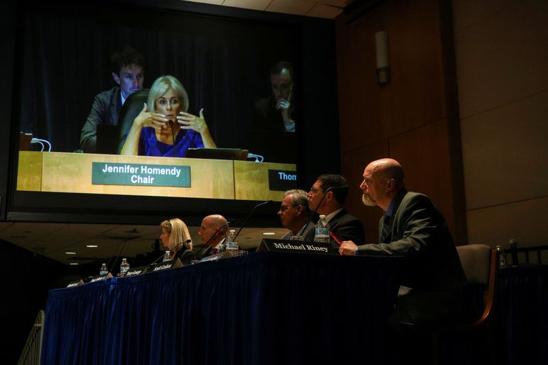 © Reuters. A display screen shows National Transportation Safety Board Chair Jennifer Homendy speaking during a NTSB hearing on the Alaska Airlines Boeing 737 MAX door accident at NTSB headquarters in Washington, U.S., August 6, 2024. REUTERS/Kaylee Greenlee Beal