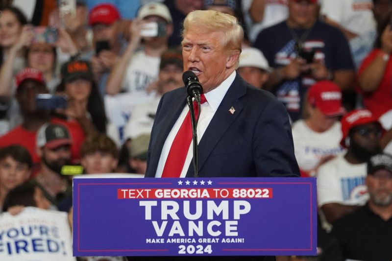 &copy; Reuters. FILE PHOTO: Republican presidential nominee and former U.S. President Donald Trump speaks during a campaign rally held with Republican vice presidential nominee Senator JD Vance, in Atlanta, Georgia, U.S., August 3, 2024.  REUTERS/Megan Varner/File Photo