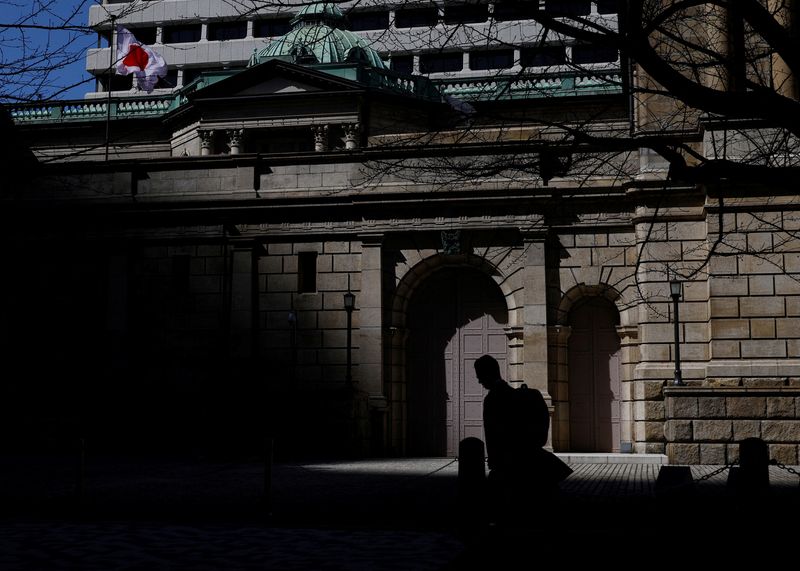 &copy; Reuters. FILE PHOTO: A man walks past the Bank of Japan building in Tokyo, Japan March 18, 2024. REUTERS/Kim Kyung-Hoon/File Photo