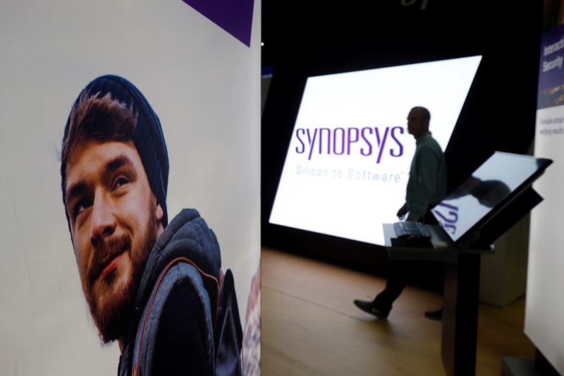 &copy; Reuters. A man walks through the Synopsys booth during the Black Hat information security conference in Las Vegas, Nevada, U.S. on July 26, 2017. REUTERS/Steve Marcus/ File Photo