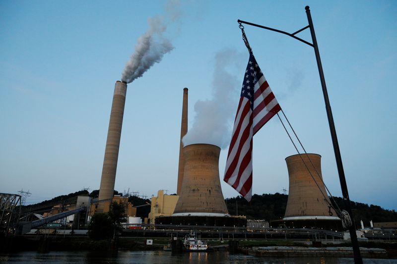 &copy; Reuters. The U.S. flag flies on Campbell Transportation's towboat M.K. McNally as it passes Mitchell Power Plant, a coal-fired power-plant operated by American Electric Power (AEP), on the Ohio River in Moundsville, West Virginia, U.S., September 10, 2017.    REUT