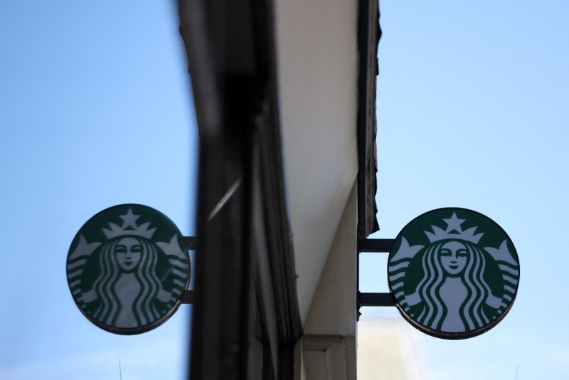 &copy; Reuters. Starbucks logo is displayed above their cafe in London, Britain, August 13, 2024. REUTERS/Hollie Adams