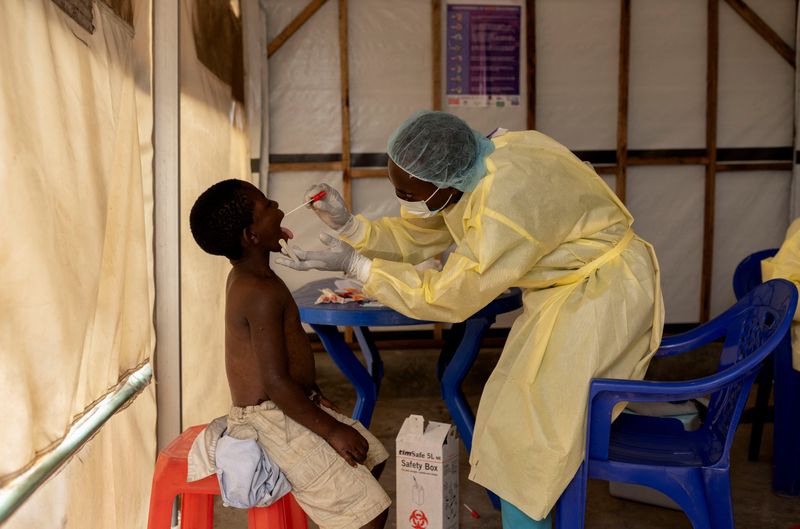 &copy; Reuters. FILE PHOTO: Christian Musema, a laboratory nurse, takes a sample from a child declared a suspected case Mpox - an infectious disease caused by the monkeypox virus that spark-off a painful rash, enlarged lymph nodes and fever; at the the treatment centre i