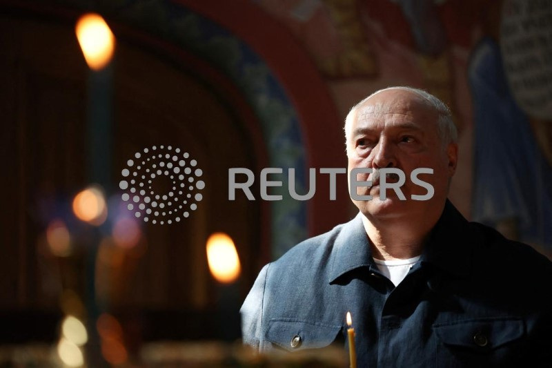 &copy; Reuters. Belarusian President Alexander Lukashenko attends a church service as he and his Russian counterpart Vladimir Putin visit the Valaam Monastery in the Republic of Karelia, Russia July 25, 2024.  Sputnik/Alexander Kazakov/Pool via REUTERS ATTENTION EDITORS