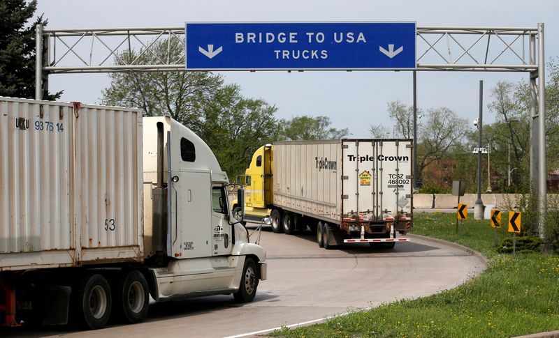 &copy; Reuters. FILE PHOTO: Semi trucks heading for Detroit, Michigan, drive on the lane to Ambassador Bridge in Windsor, Ontario, Canada, April 28, 2017. REUTERS/Rebecca Cook/File Photo