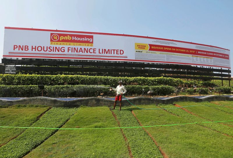 &copy; Reuters. FILE PHOTO: A gardener waters a lawn in front of an advertisement for India's PNB Housing Finance Ltd. initial public offering (IPO) in Mumbai, India, October 25, 2016. Picture taken October 25, 2016.  REUTERS/Shailesh Andrade/File Photo