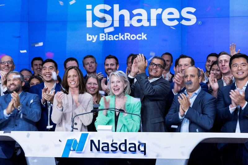 &copy; Reuters. FILE PHOTO: Samara Cohen, BlackRock's CIO of ETF and Index Investments stands next to supporters and colleagues while she attends the closing bell to celebrate the launch of the first U.S. spot Ethereum ETF at the Nasdaq MarketSite, at Times Square in New