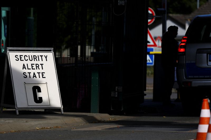 © Reuters. A vehicle is checked at the main gate after NATO air base in the German town of Geilenkirchen has raised its security level 