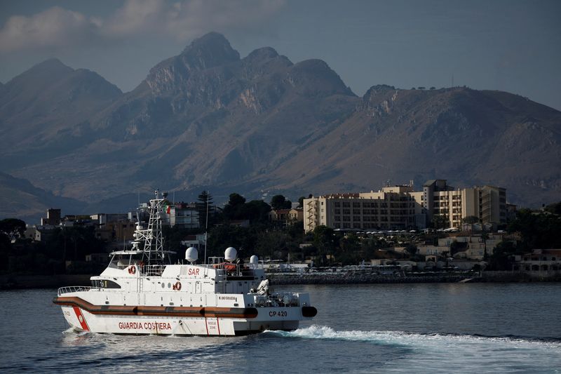 © Reuters. A Coast Guard vessel is pictured in front of the Domina Zagarella Sicily hotel where the survivors are staying, after a luxury yacht sank, as search operations resume for British tech entrepreneur Mike Lynch's daughter Hannah Lynch, off the coast of Porticello, near the Sicilian city of Palermo, Italy, August 23, 2024. REUTERS/Louiza Vradi