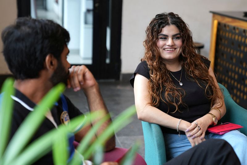 © Reuters. Afeefa talks to another attendee during a matchmaking event called 