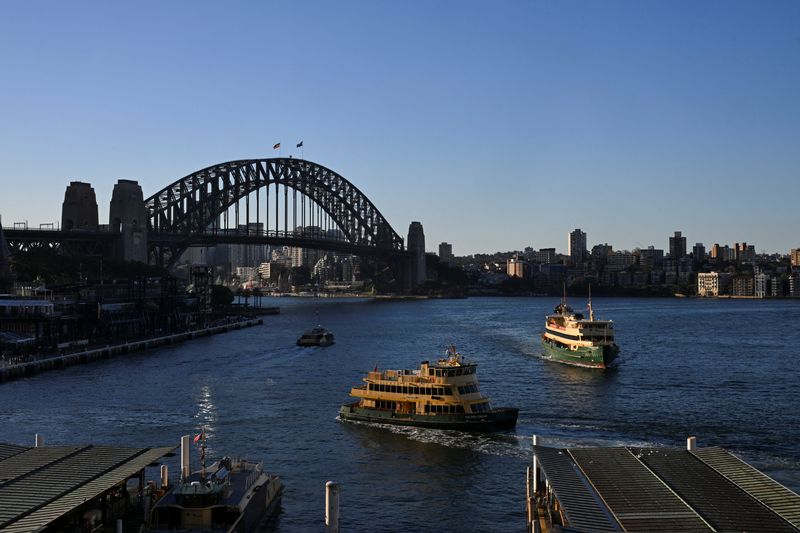 &copy; Reuters. Passenger ferries move by the Sydney Harbour Bridge in Circular Quay, Sydney, Australia, May 14, 2024. REUTERS/Jaimi Joy/ File Photo