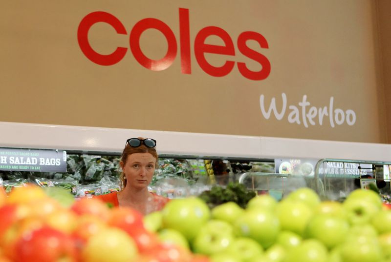 © Reuters. A woman walks in the fruit and vegetables section at a Coles supermarket in Sydney, Australia, February 20, 2018. REUTERS/Daniel Munoz/File Photo