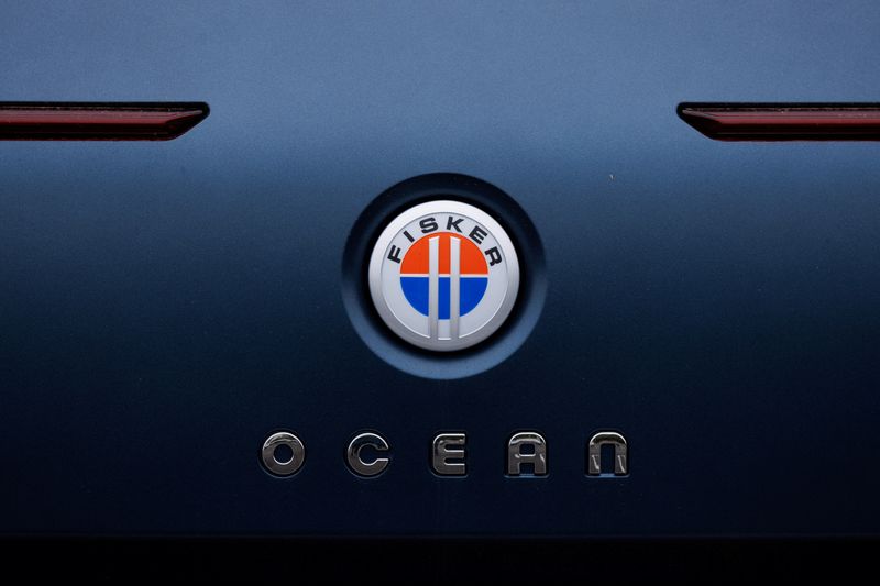 &copy; Reuters. FILE PHOTO: The Fisker logo is shown on the back of a Fisker Ocean electric SUV vehicle at one of the company’s sales, service ands delivery centers in Vista, California, U.S., May 22, 2024. REUTERS/Mike Blake/File Photo