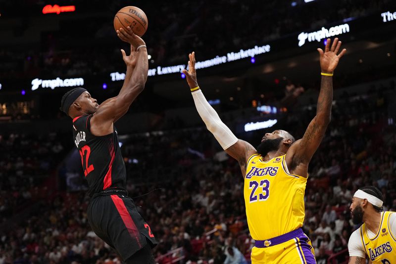 &copy; Reuters. FILE PHOTO: Nov 6, 2023; Miami, Florida, USA; Miami Heat forward Jimmy Butler (22) shoots over Los Angeles Lakers forward LeBron James (23) during the first half at Kaseya Center. Mandatory Credit: Jasen Vinlove-USA TODAY Sports/File photo