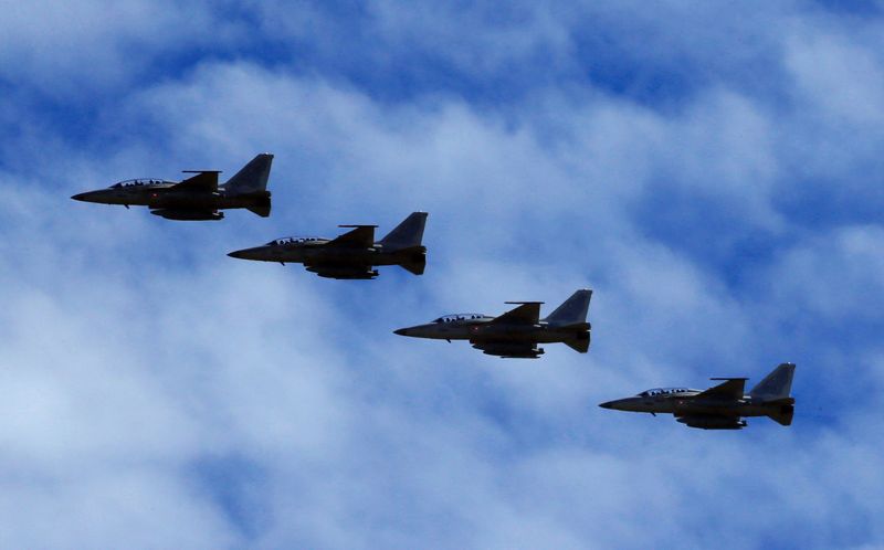 &copy; Reuters. FILE PHOTO: FA-50 fighter jets, newly purchased from South Korea, are escorted by fighter jets in the sky upon arrival in Clark air base, Angeles city, Pampanga province, north of Manila, Philippines December 1, 2016.  REUTERS/Romeo Ranoco/File Photo