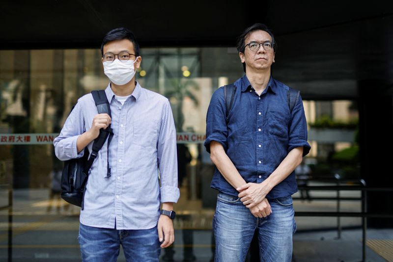 © Reuters. FILE PHOTO: Chung Pui-kuen, former chief editor of the now-shuttered Stand News, and Patrick Lam, former acting chief editor, leave the District Court during the hearing on charges of conspiring to publish seditious publications, in Hong Kong, China on June 27, 2023. REUTERS/Tyrone Siu/File Photo