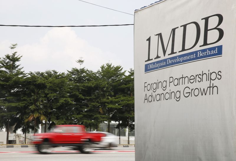 &copy; Reuters. FILE PHOTO: Traffic passes a 1Malaysia Development Berhad (1MDB) billboard at the Tun Razak Exchange development in Kuala Lumpur, Malaysia, July 6, 2015. REUTERS/Olivia Harris/File Photo