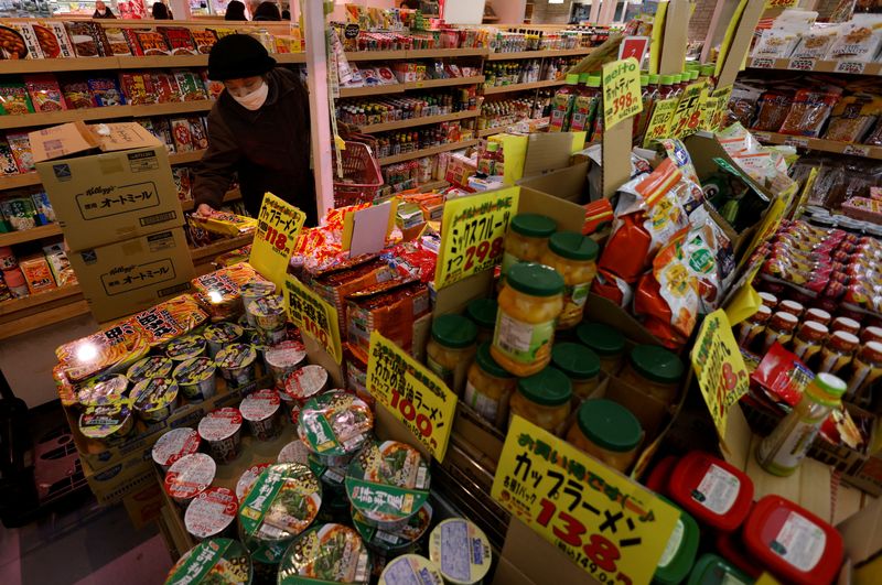 &copy; Reuters. FILE PHOTO: A shopper checks food items at a supermarket in Tokyo, Japan January 20, 2023. REUTERS/Issei Kato/File Photo