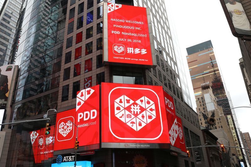 © Reuters. FILE PHOTO: A display at the Thomson Reuters building shows a message after Chinese online group discounter Pinduoduo Inc. (PDD) was listed on the Nasdaq exchange in Times Square in New York City, New York, U.S., July 26, 2018. REUTERS/Mike Segar