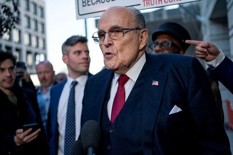 &copy; Reuters. FILE PHOTO: Former New York Mayor Rudy Giuliani departs the U.S. District Courthouse after he was ordered to pay $148 million in his defamation case in Washington, U.S., December 15, 2023. REUTERS/Bonnie Cash/File Photo