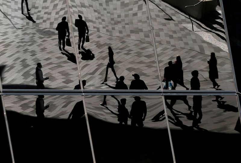 &copy; Reuters. FILE PHOTO: Workers are reflected in an office building's windows in Sydney's Barangaroo business district in Australia's largest city, May 8, 2017.  REUTERS/Jason Reed/File Photo