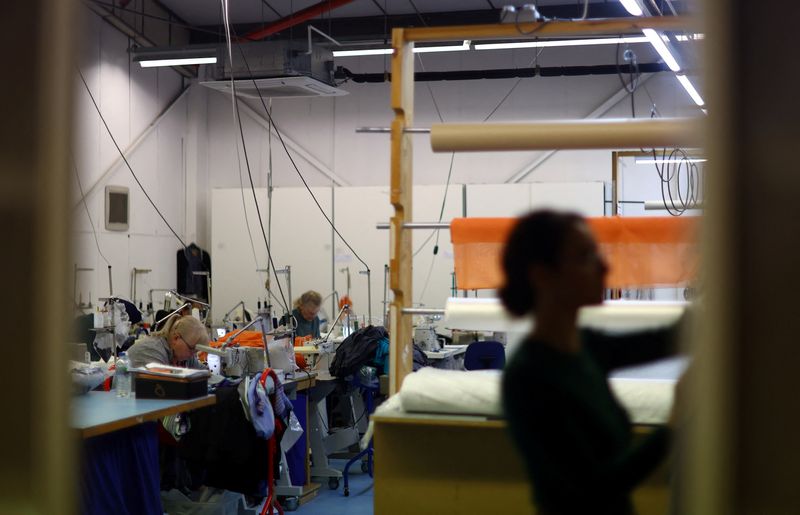 &copy; Reuters. FILE PHOTO: Machinists are seen at work on the factory floor of Fashion-Enter Ltd in London, Britain, February 15, 2023. REUTERS/Hannah McKay/File photo