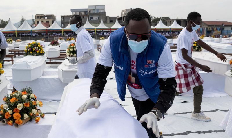 &copy; Reuters. Civil society workers arrange coffins of civilians killed during the clashes between M23 rebels and the Armed Forces of the Democratic Republic of the Congo (FARDC), at a mourning ceremony held at the Stade de l'Unite in Goma, North Kivu, Democratic Repub