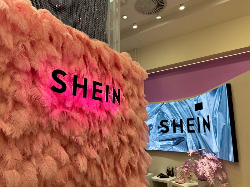 © Reuters. FILE PHOTO: Shein logo is seen inside the company's first pop-up store in Johannesburg, South Africa, August 2, 2024. REUTERS/Sisipho Skweyiya/File Photo