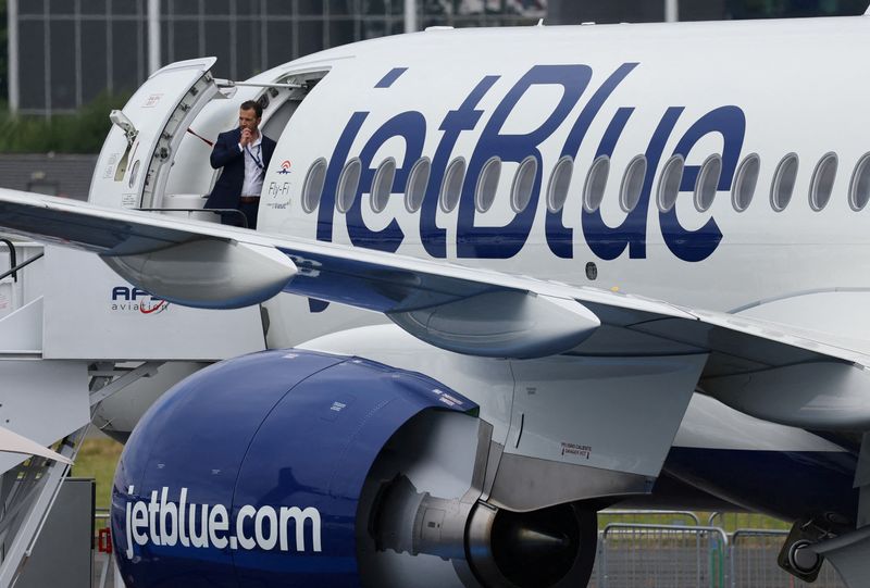 &copy; Reuters. FILE PHOTO: Branding for JetBlue Airlines is seen at the Farnborough International Airshow, in Farnborough, Britain, July 22, 2024. REUTERS/Toby Melville/File Photo