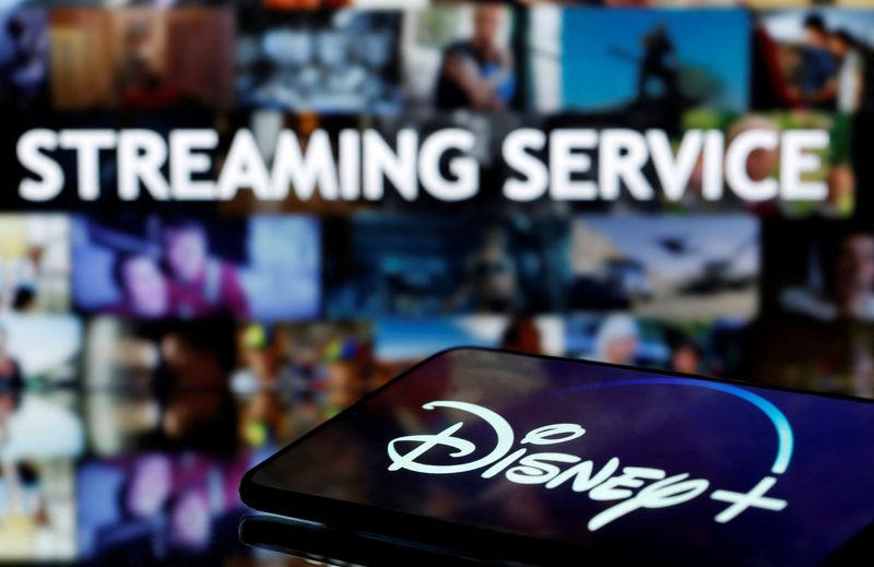 &copy; Reuters. FILE PHOTO: A martphone with displayed "Disney" logo is seen in front of displayed "Streaming service" words in this illustration taken March 24, 2020. REUTERS/Dado Ruvic/File Photo